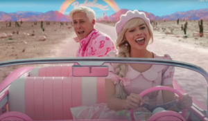 Screen capture from the movie Barbie. Features Barbie and Ken in a pink convertible car driving away from Barbieland and toward the viewer. Barbie is driving and Ken is in the back seat.